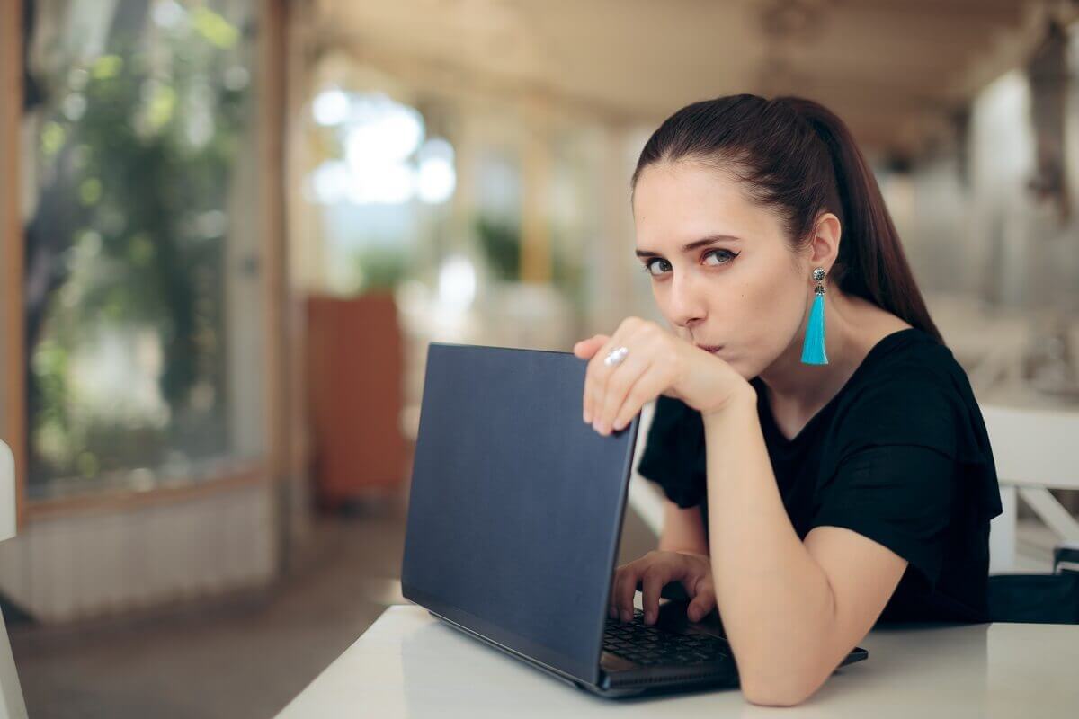 woman hiding laptop screen