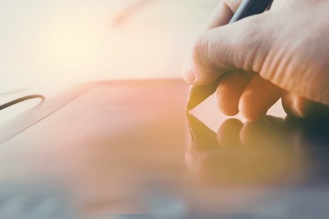 person signing tablet