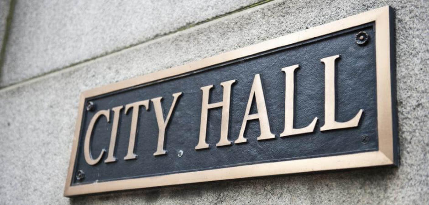 city hall sign on building