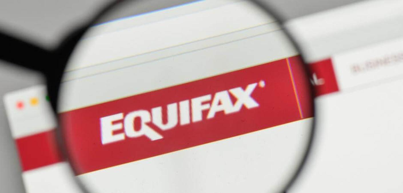 Equifax logo under magnifying glass