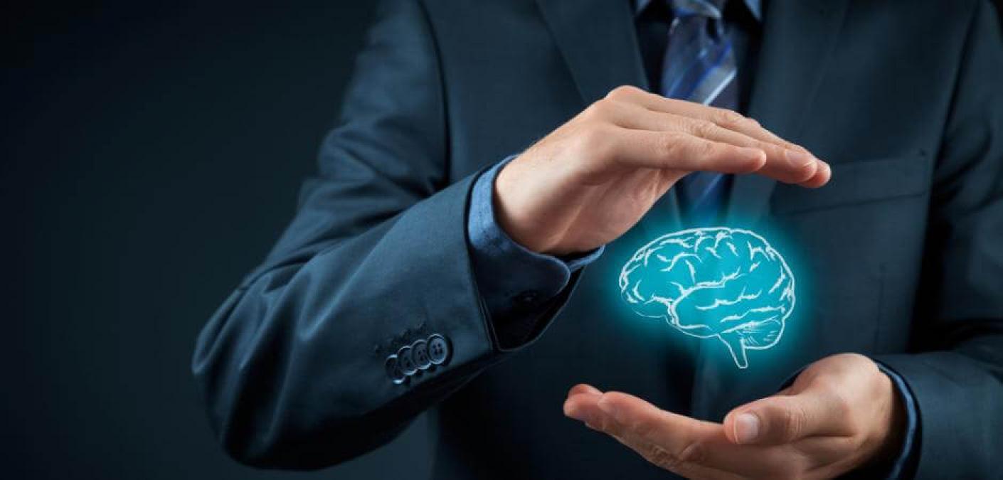 man holding brain image