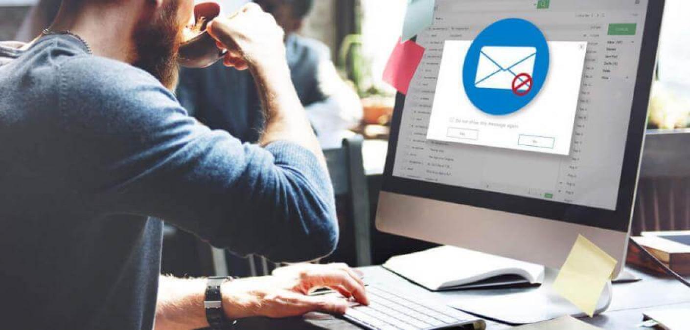 man drinking coffee with email error on screen