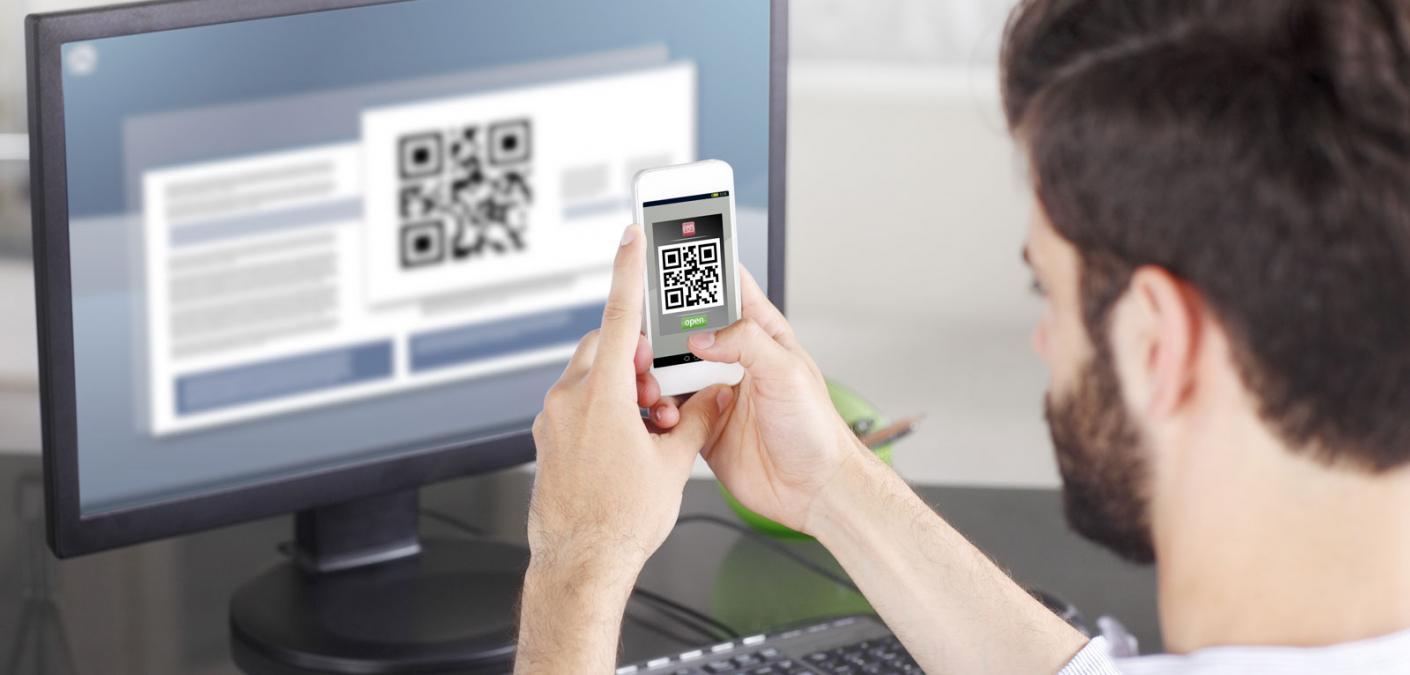 man scanning QR code with phone