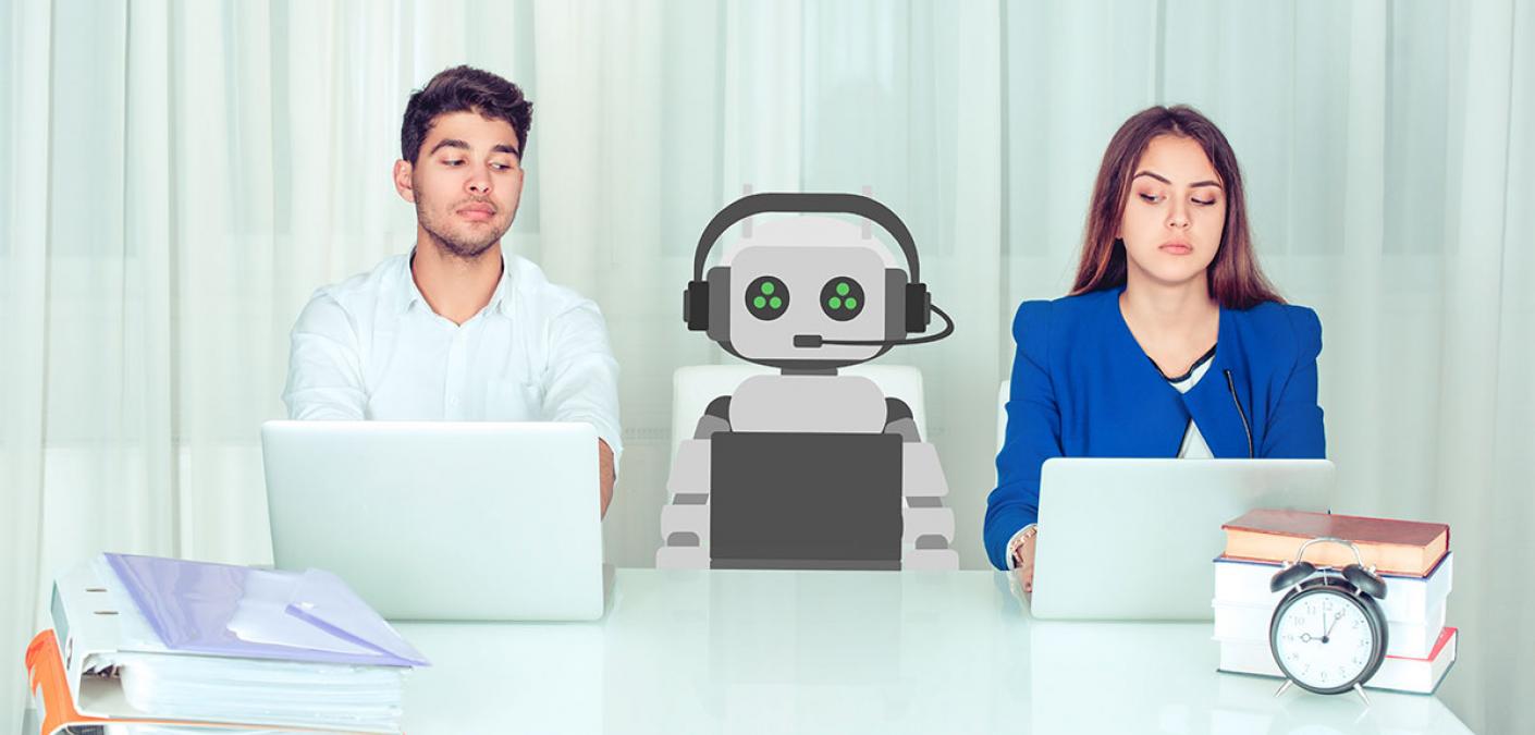 two people working with a cartoon robot