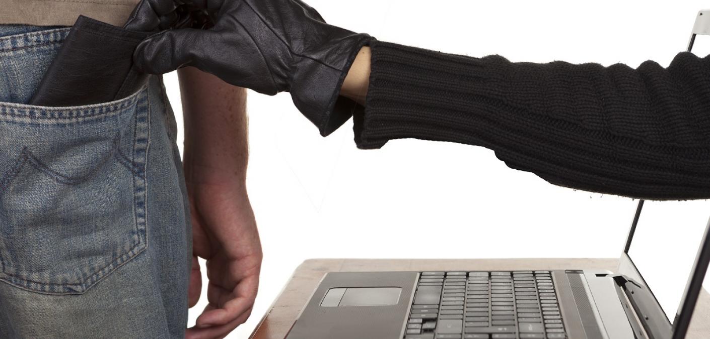 thief's hand coming through laptop screen and stealing wallet from man's back pocket